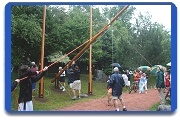 Raising the centerpiece 36' flagpole on July 4th.